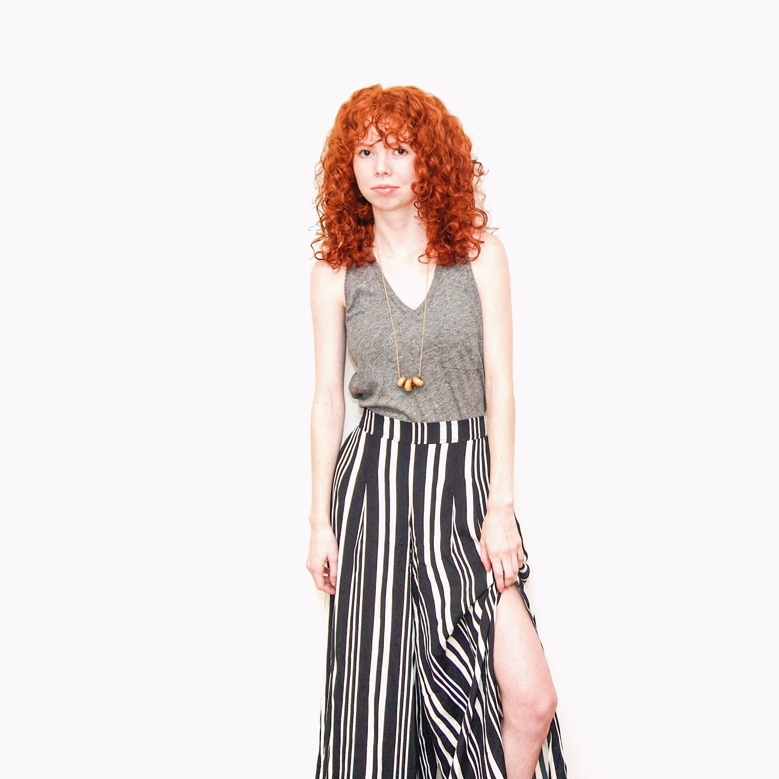 girl-in-gray-tank-and-striped-pants