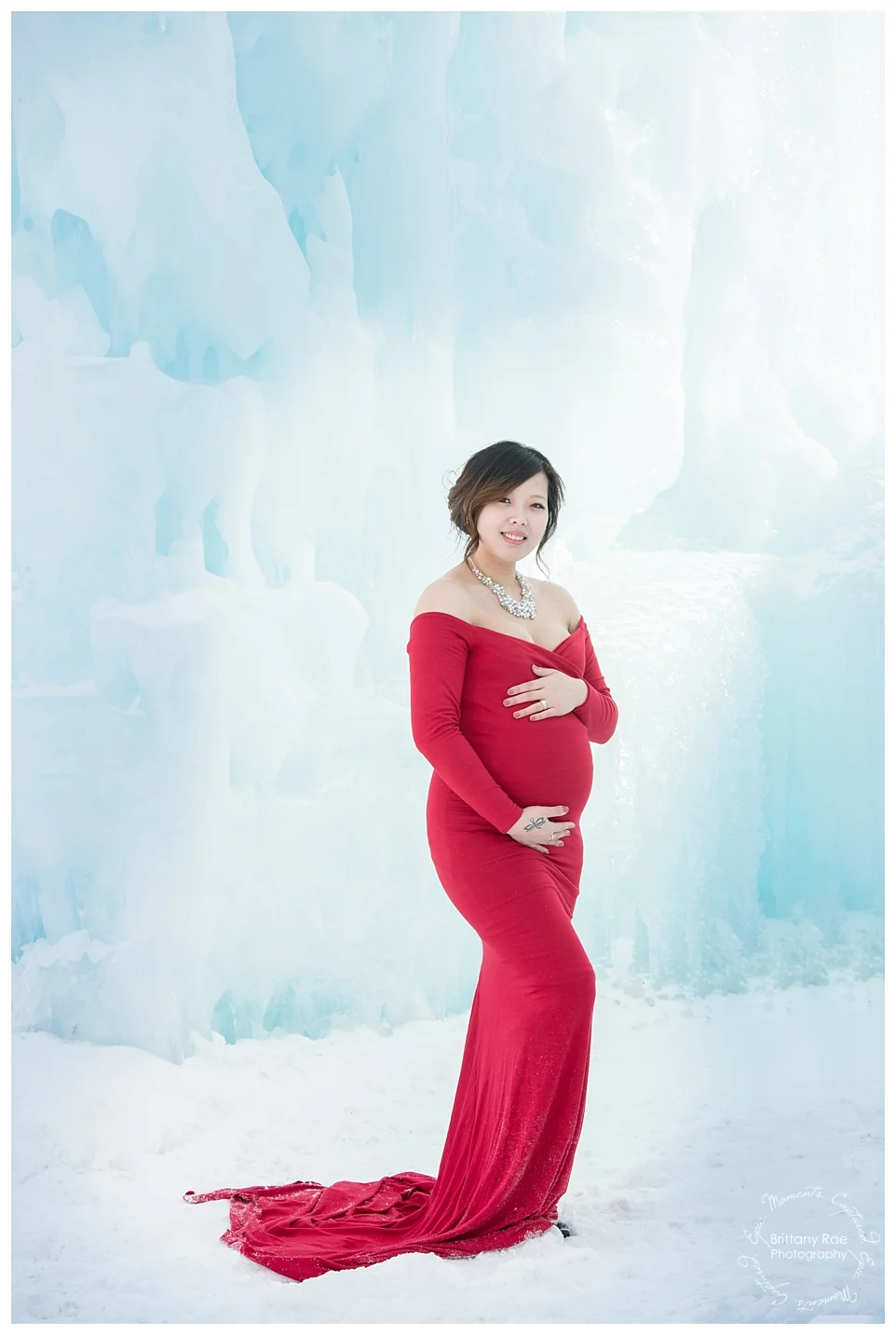 Ice Castle Maternity Photos in Lincoln New Hampshire by Maternity Photographer -