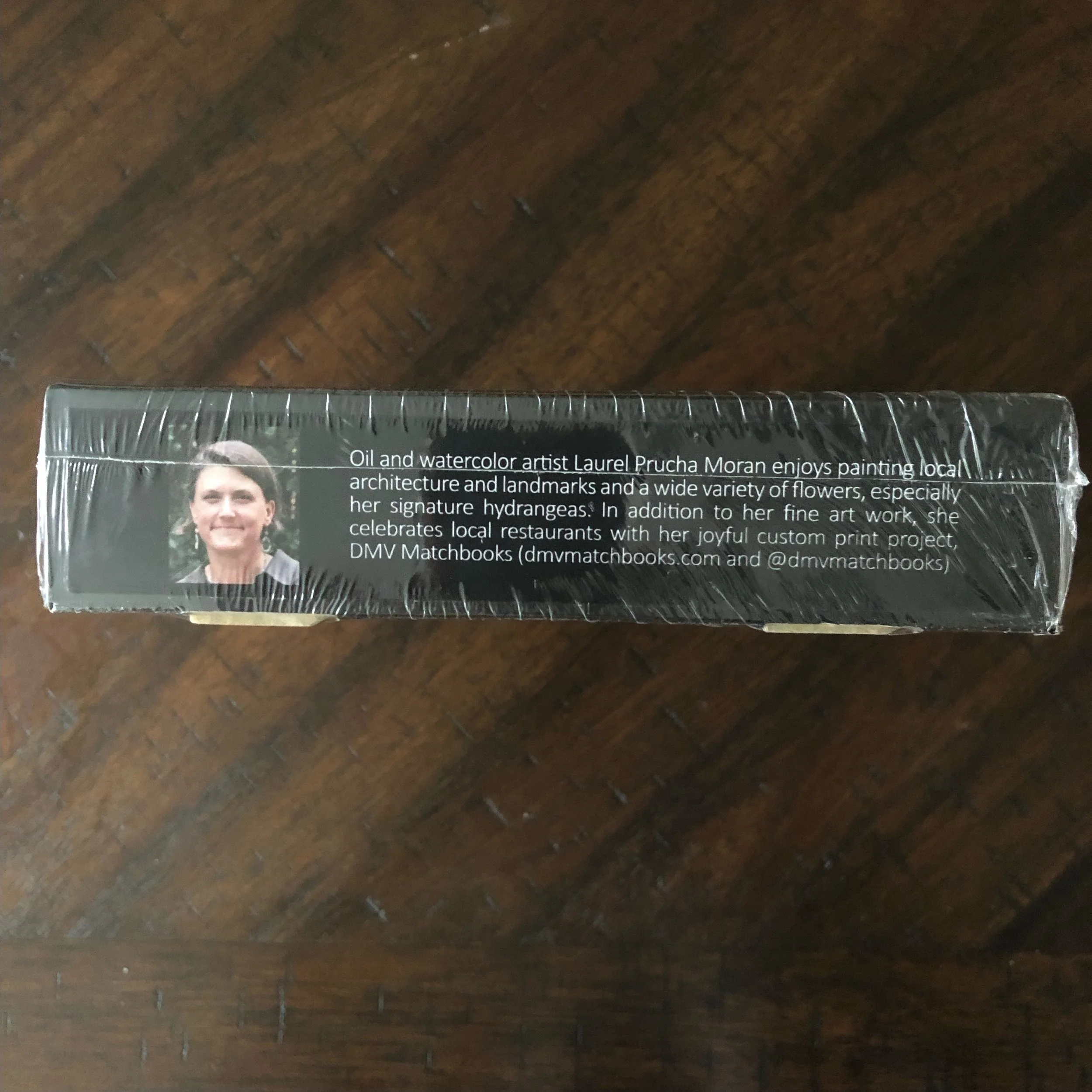 1000-piece puzzle of Old Town Shops by Alexandria artist Laurel Prucha Moran