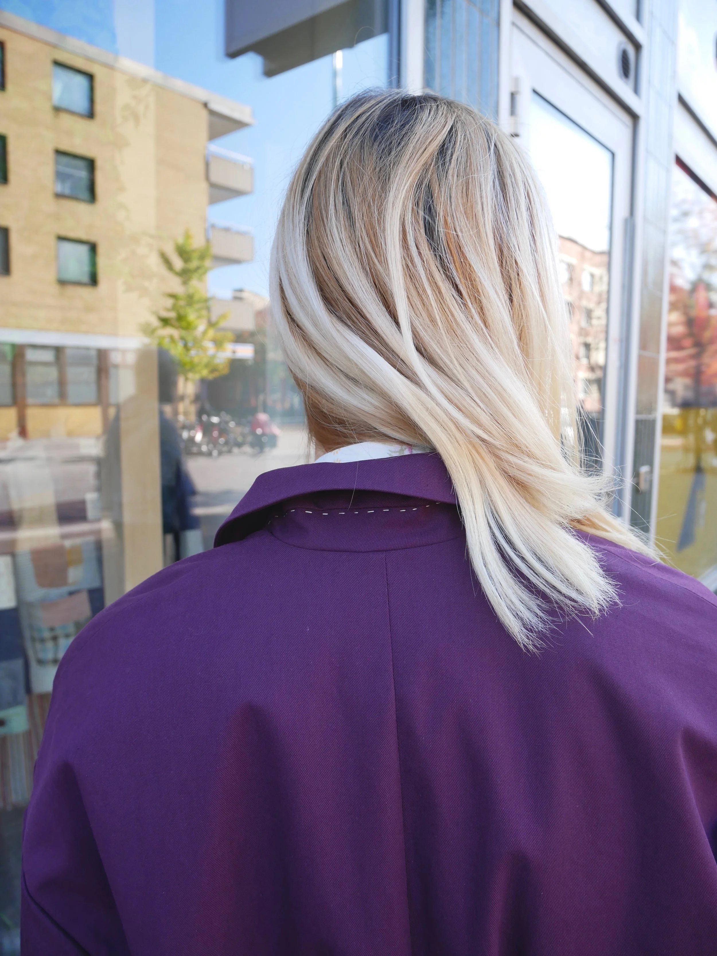 Unisex royal purple trench coat made from GOTS certified organic cotton with corozo buttons. Made in Malmö, Sweden.