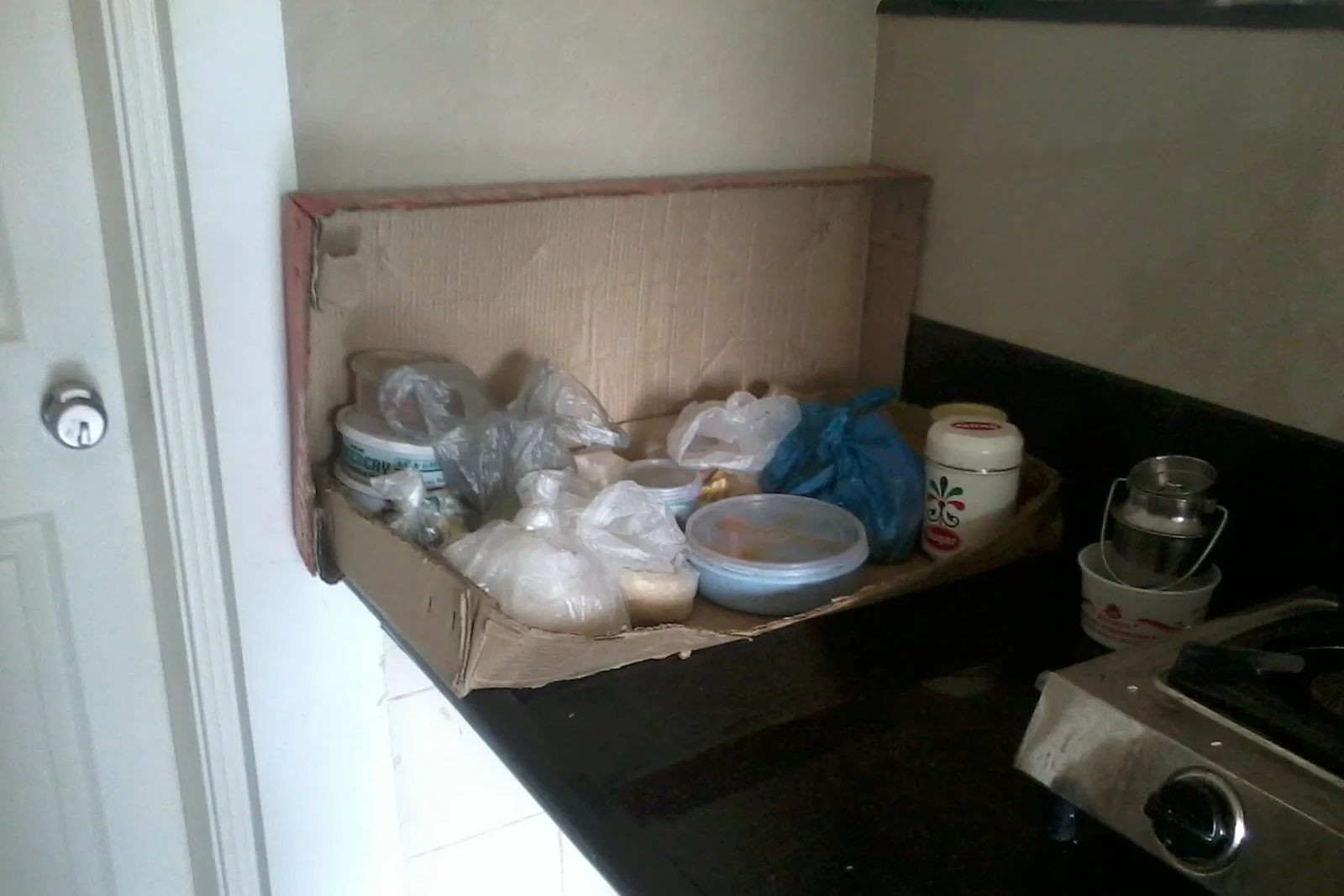 UNORGANIZED : Cardboard carton used as a stand which becomes soggy and damaged