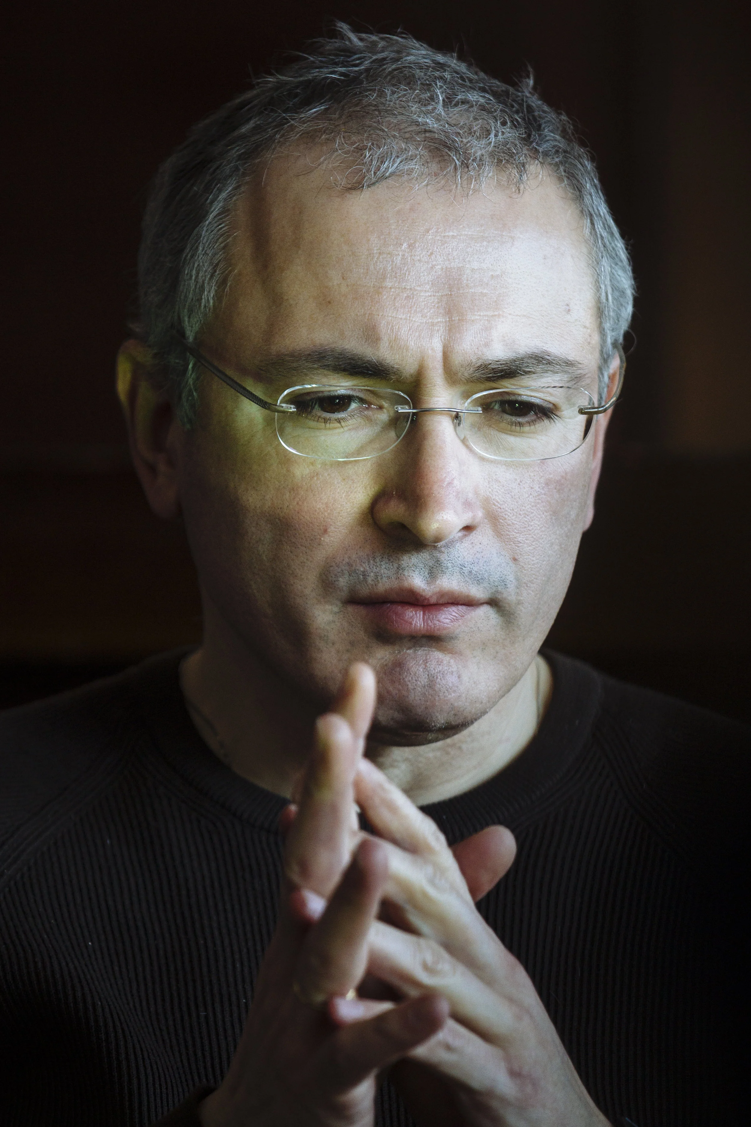 Exiled Russian businessman Mikhail Khodorkovsky listens to a question during a roundtable with journalists at a hotel in Kiev, Ukraine, Monday, March 10, 2014. (AP Photo/David Azia)