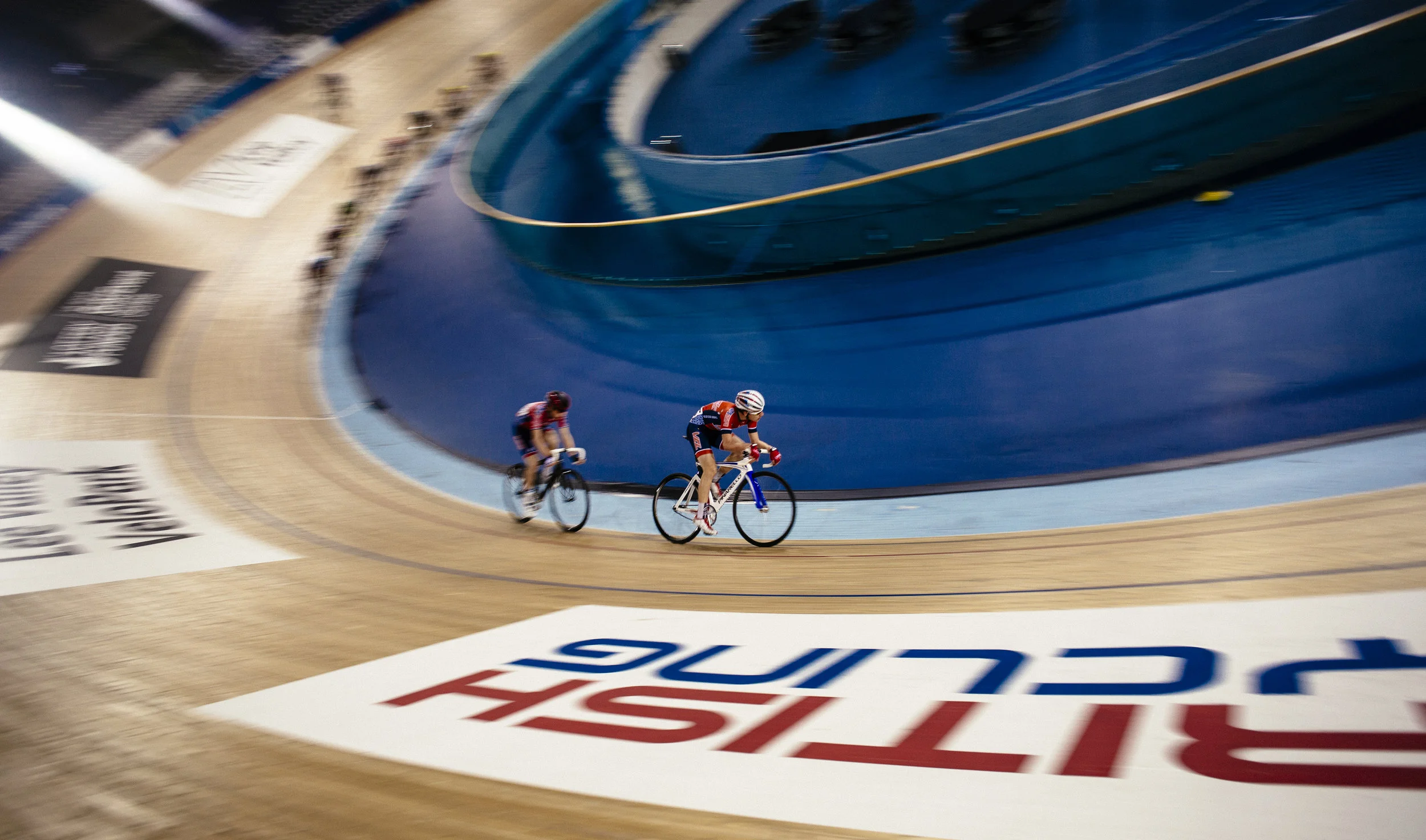 Competitors round the track during an amateur competition at the Lee Valley Velodrome, London, Tuesday, Dec. 1, 2015.