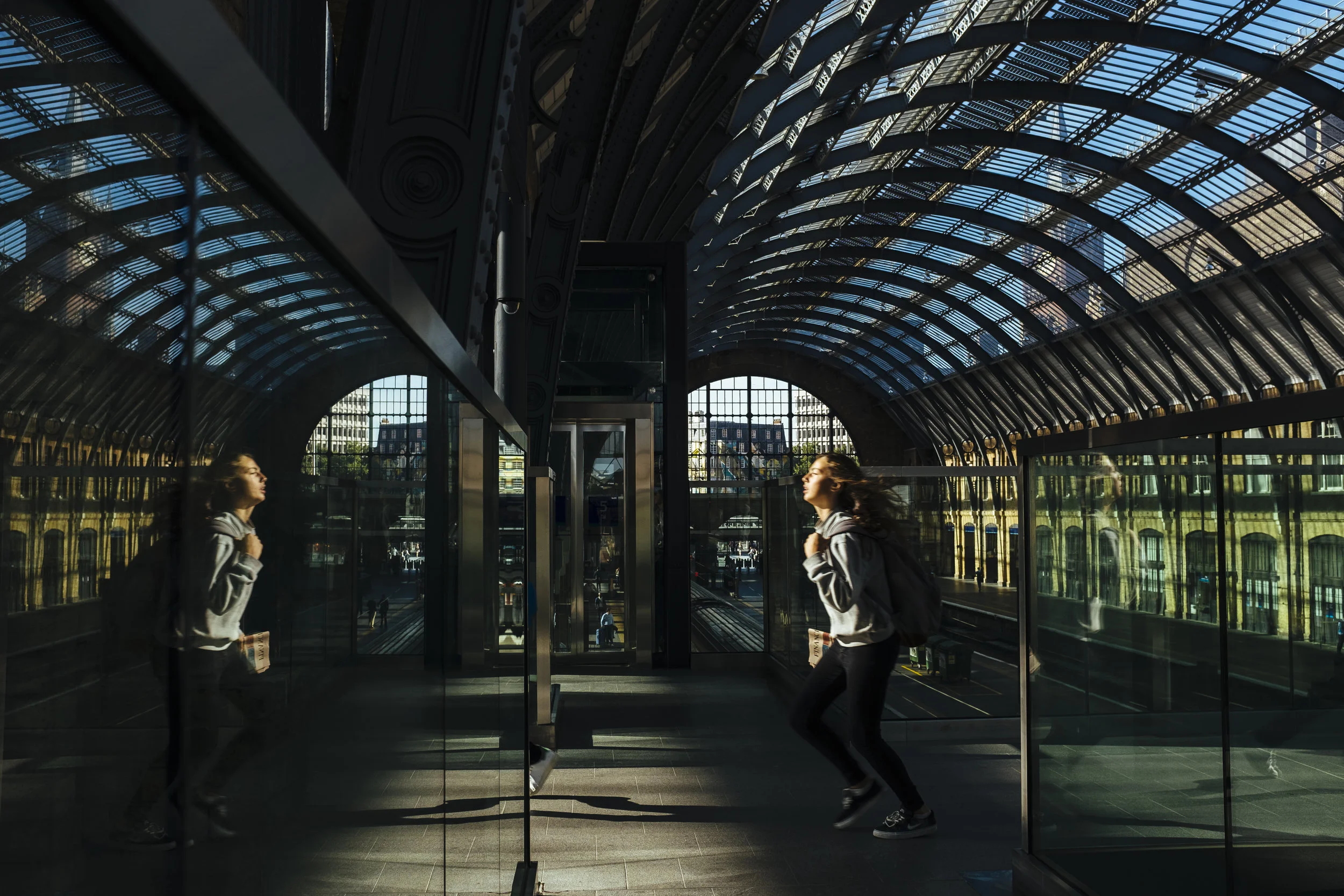 A passenger runs to catch a train at King's Cross railway station in London, Monday, Aug. 17, 2015.