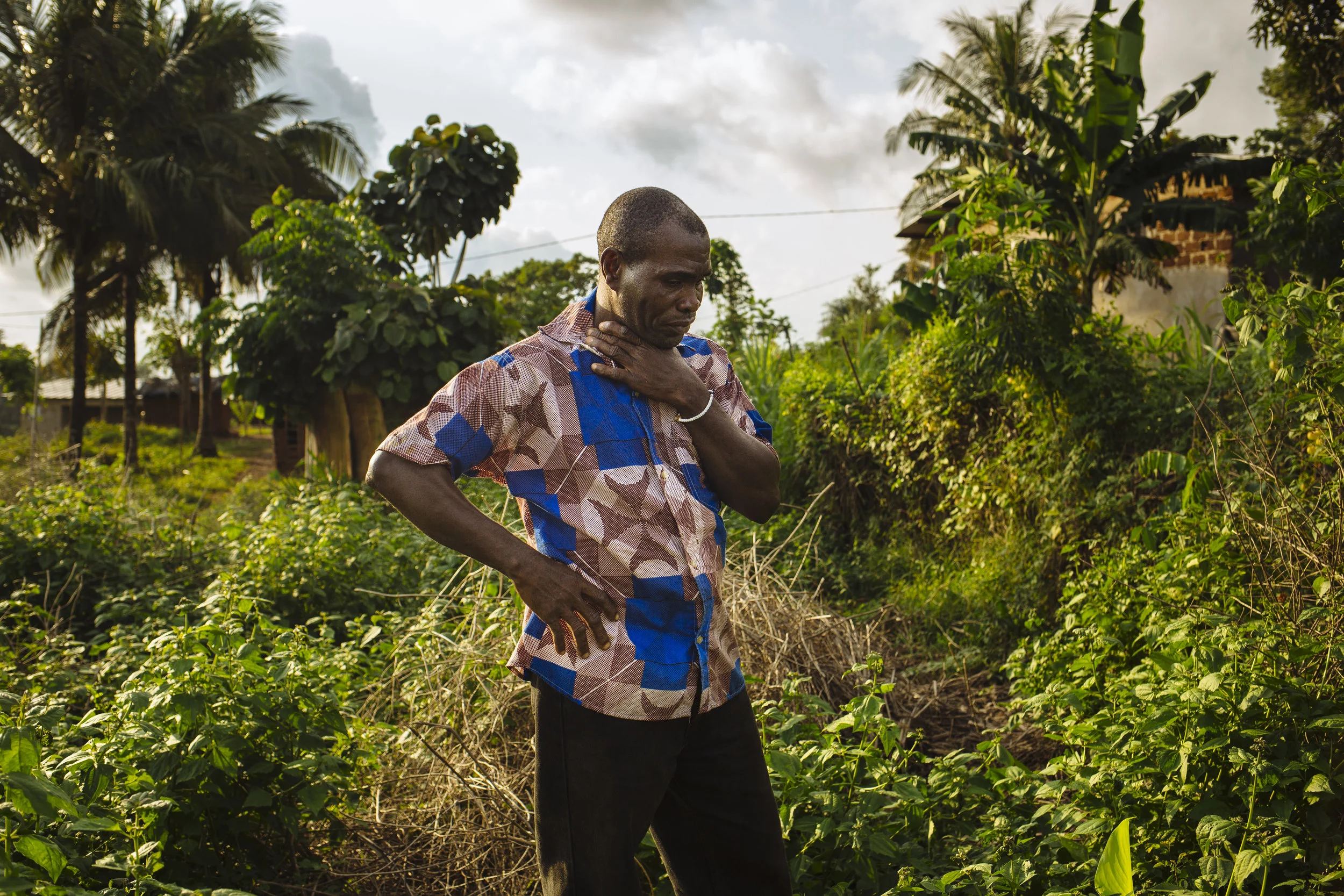 Gbohoun Hie breaks down in tears as he stands on the site where his home once stood in Tabou, Bas-Sassandra District, Côte d'Ivoire.