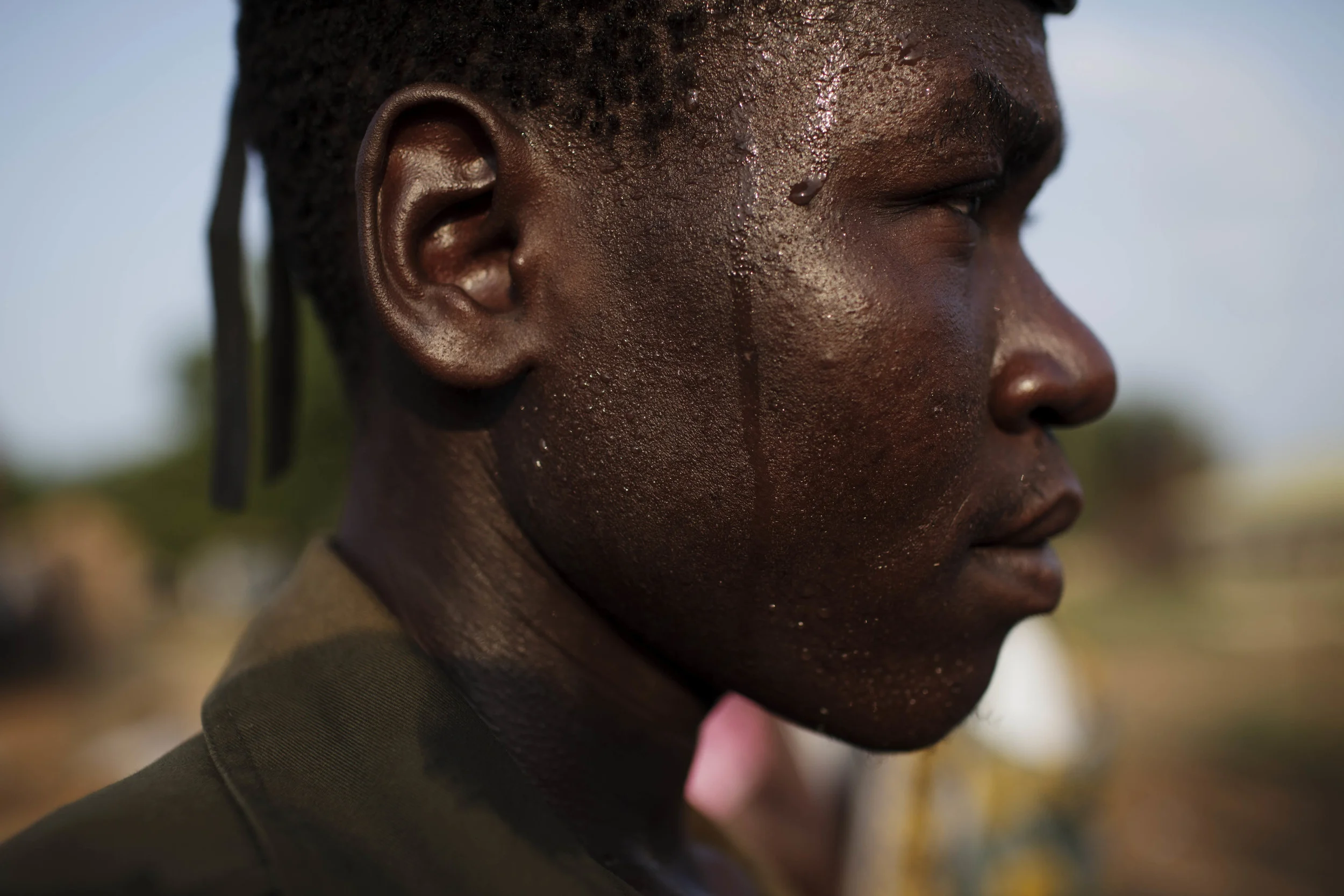 A prison service officer attends celebrations by Bari community members on the eve of South Sudan's declaration of independence in Juba, southern Sudan, Friday, July 8, 2011. (AP Photo/David Azia)