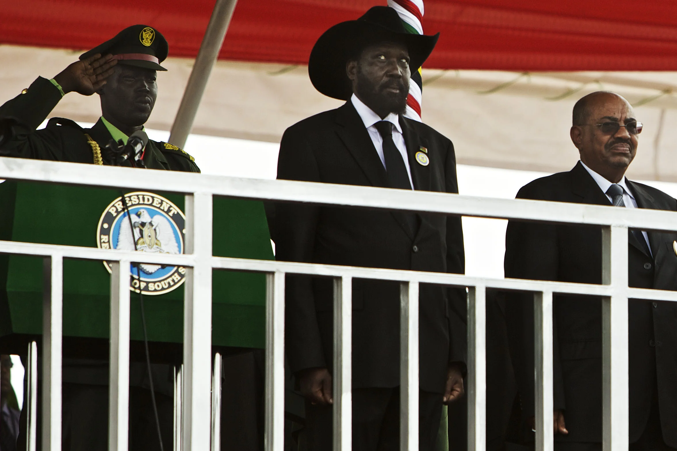 South Sudan's president Salva Kiirr, left, and Sudan's President Omar al-Bashir stand on the podium at the start of independence celebrations in Juba, South Sudan, Saturday, July 9, 2011. (AP Photo/David Azia)