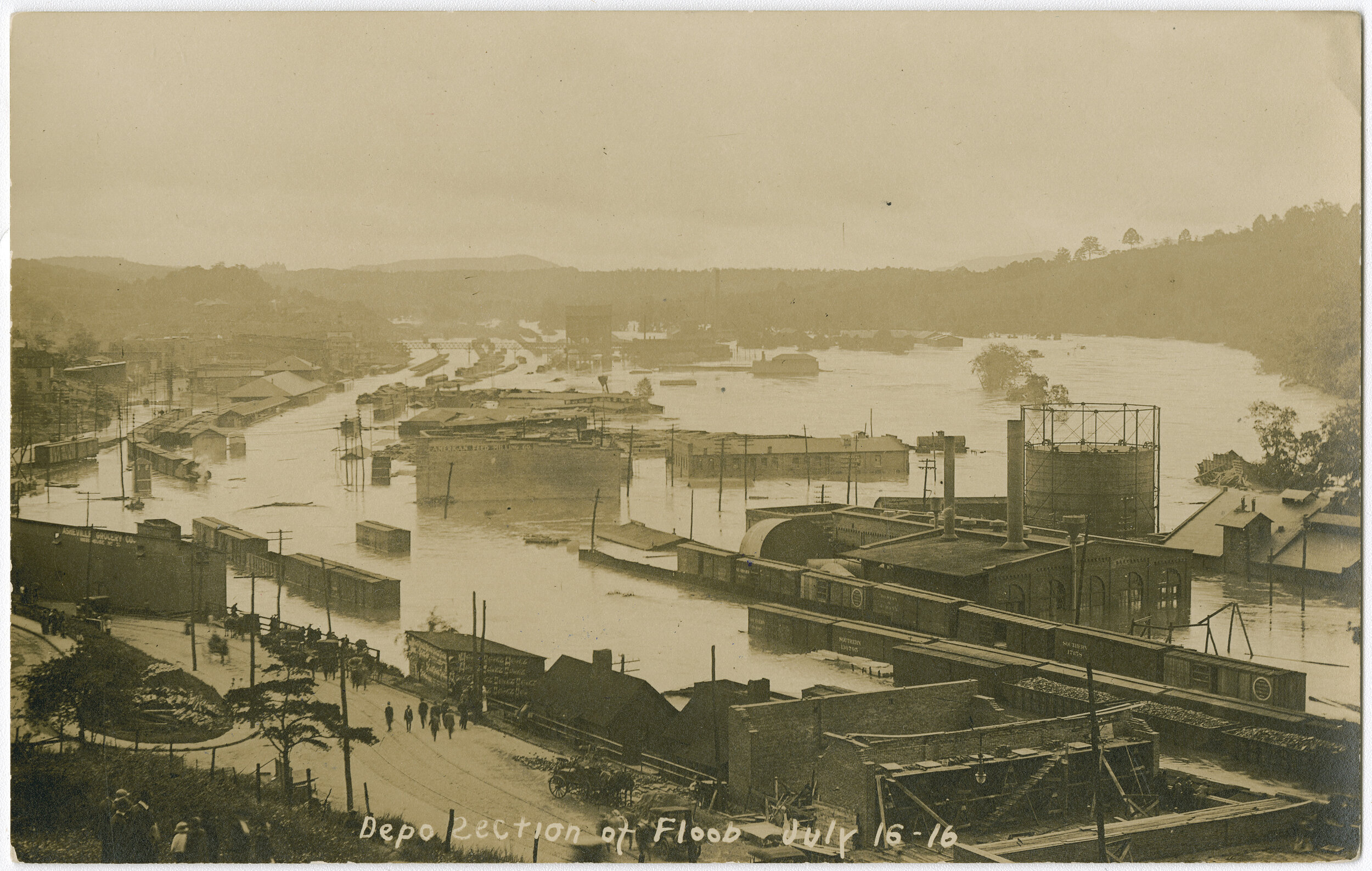 Postcard of the flood in the River Arts District from July 16, 1916. Looking from Haywood Road bridge south towards CURVE Studios.