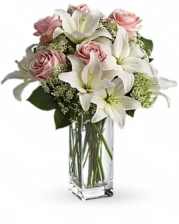 Heavenly And Harmony Heavenly hues and pretty petals are in perfect harmony in this gorgeous arrangement. Lovely for a birthday, anniversary or just because, it's simply stunning! Light pink roses, white asiatic lilies, Queen Anne's lace and salal are beautifully arranged in a glass vase. Heaven sent? Well, someone will think you're an angel for sending it! Buy Now>>