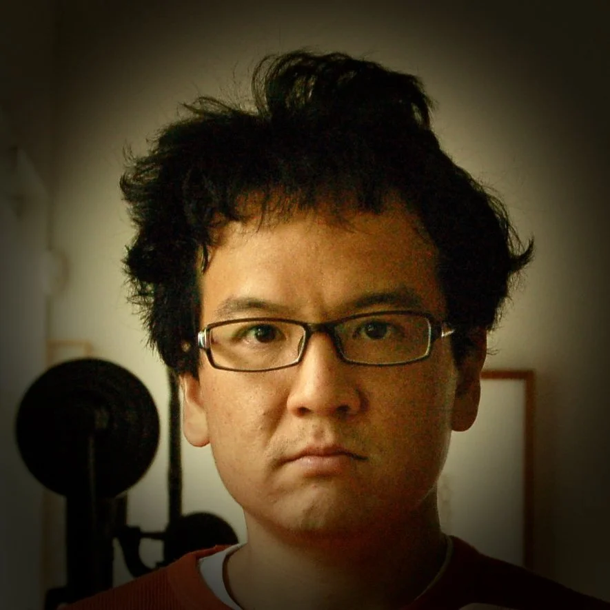 A headshot of artist Roger Chen from Mizzonk, a Taiwanese Canadian artist duo based in Canada.