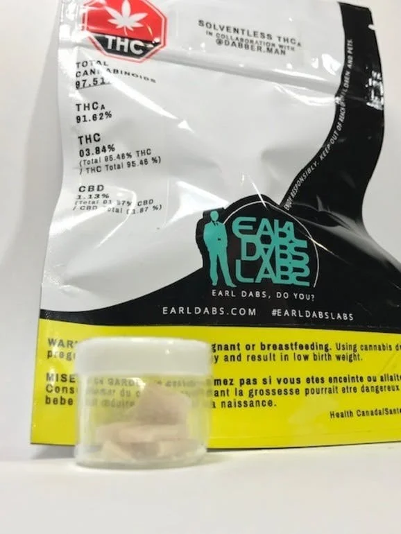Solventless THCa - 1G - $80 NEW PRICE! To create the finest THCa, it starts with the plants; how they were grown and when they were harvested. There is a specific moment during flowering that is best to harvest for THCa production and fresher, more recently harvested crops, contain the highest levels of THCa. Often thought to be the direct precursor to THC, recent studies have shown that THCa is actually the precursor to CBGa (cannabigerolic-acid), which then gets converted to THC through oxidocyclization, with the natural assistance of the enzyme THCa-synthase. By harvesting at a precise moment, we can control the natural development of the isomers and choose when the cannabinoid levels are at the absolute best for THCa extraction. Grown & extracted at the EarlDabsLabs, we refine and enhance the extract using proprietary techniques in collaboration with Toronto's infamous rosin-presser, DabberMan. We always create our solventless THCa in small batches (approx 1-gram at a time) meticulously ensuring that each batch is one of the purest and most potent isolates found anywhere in Canada. We use specially formulated techniques, utilizing mechanical separation, at precise and controlled temperatures, to naturally separate >96% of the THCa from the extract, without the use of solvents. Our solventless THCa consists of two isomers: THCa-A, in which the carboxyl group is in the 1st position, between the hydroxyl group and the carbon chain, as well as THCa-B, in which the carboxyl group is in the 3rd position, following the carbon chain. Unlike THCa found in other extracts, our solventless THCa is very stable and will take up to 10x longer to decarboxylate into THC during storage. Also, once heated or burned, the decarboxylation is rapid but not complete, thereby achieving the benefits of both THC and THCa. This has been proven in test results, as THCa was detectable in people who smoked or otherwise consumed our solventless THCa extract. Total Cannabinoids 97.51% THCa 91.62% THC 03.84% CBD 1.13%
