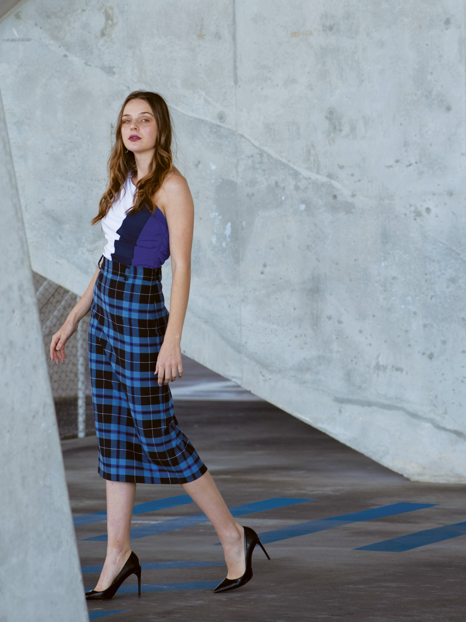 The Asymmetrical Top has a drawstring accent on the shoulder with an invisible left side zipper. The designer, Lina Mayorga used upcycled fabrics to create this multi-colored top that can be easily paired with prints and denim.
