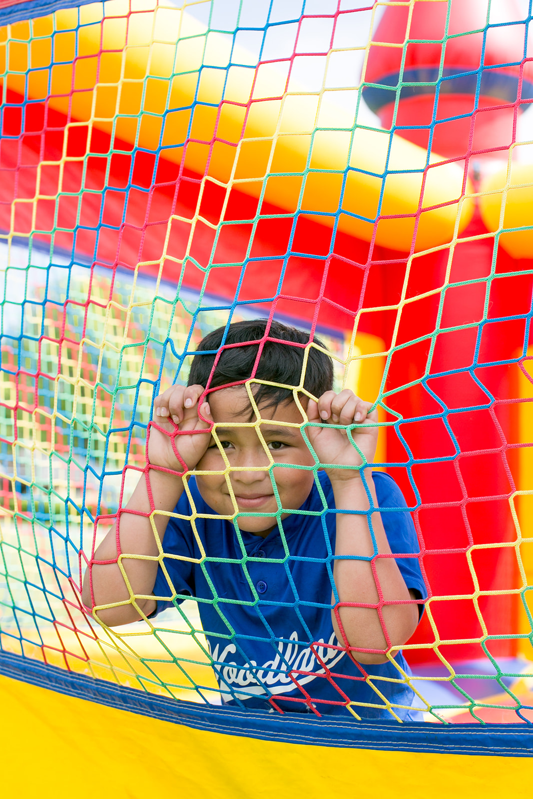 photo of elementary boy in bounce house