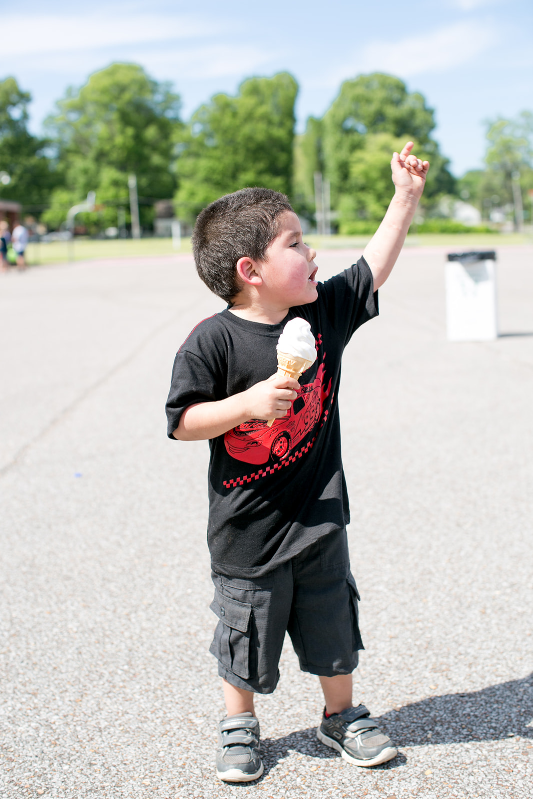 little boy holding ice cream cone