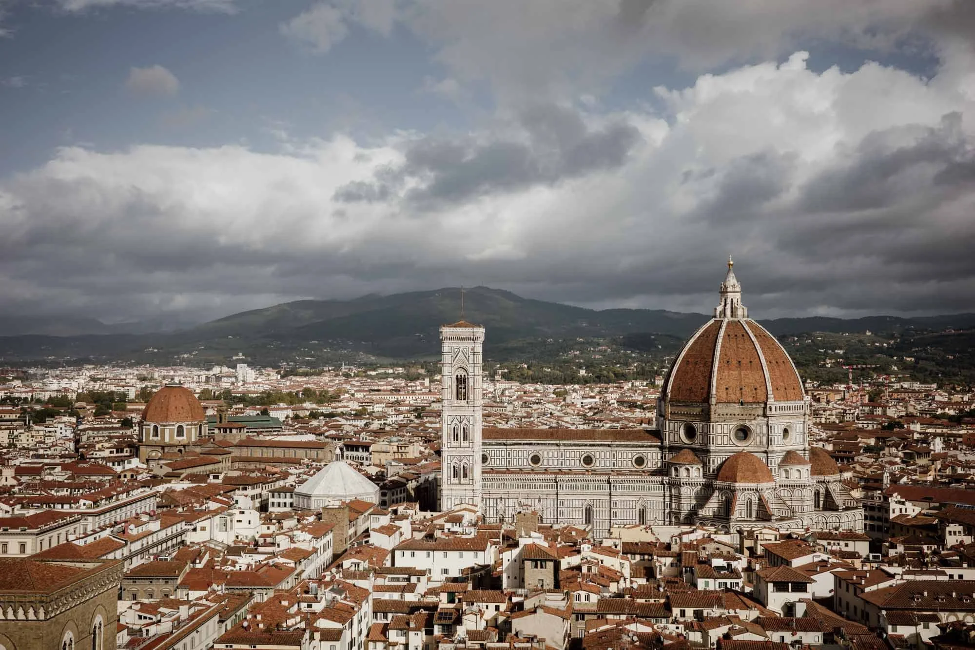View of the Duomo with the hills of Tuscany behind in Florence, Italy