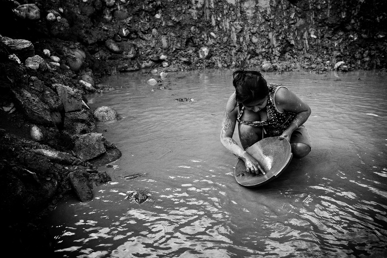 A woman washing gold. Tipuani, Bolivia. 