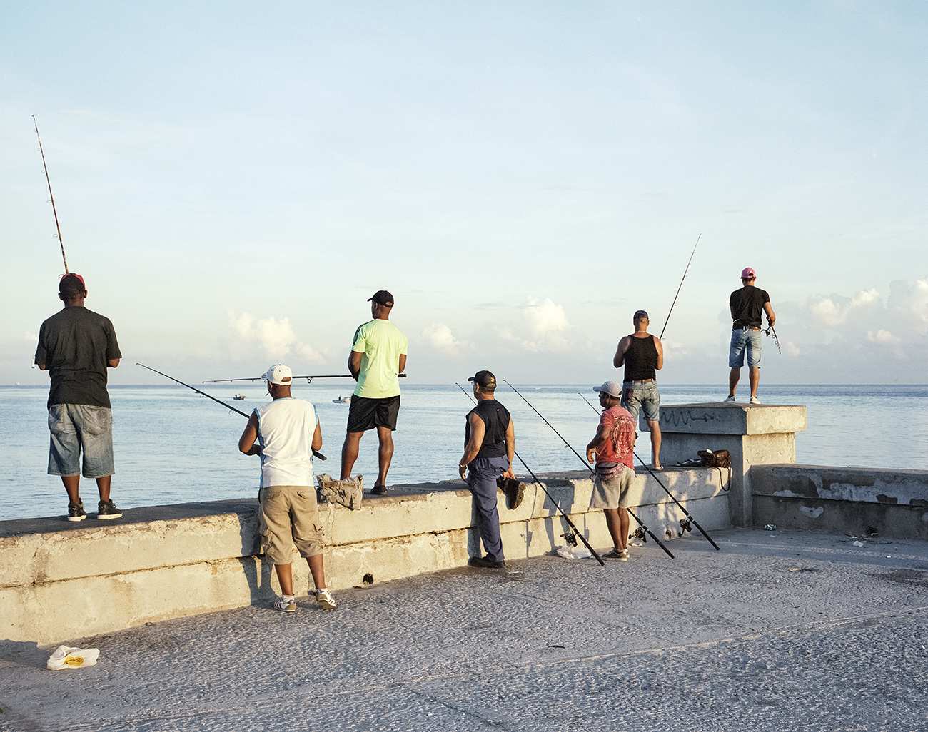 People fishing on the Malécon. La Habana, Cuba 2018