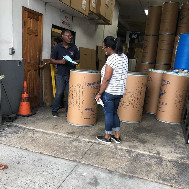 Founder/CEO Ambers doing the final inspection before send off the school supplies