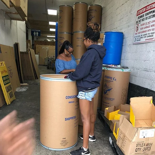 Team packing up the barrel to send to the schools in Jamaica