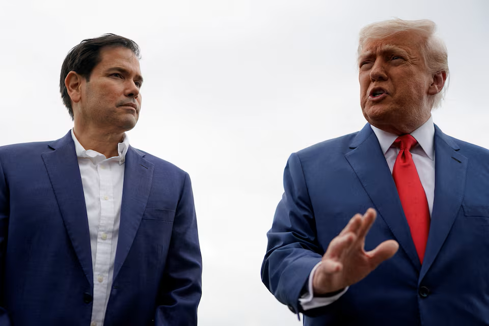 U.S. President Donald Trump stands with U.S. Secretary of State Marco Rubio.png