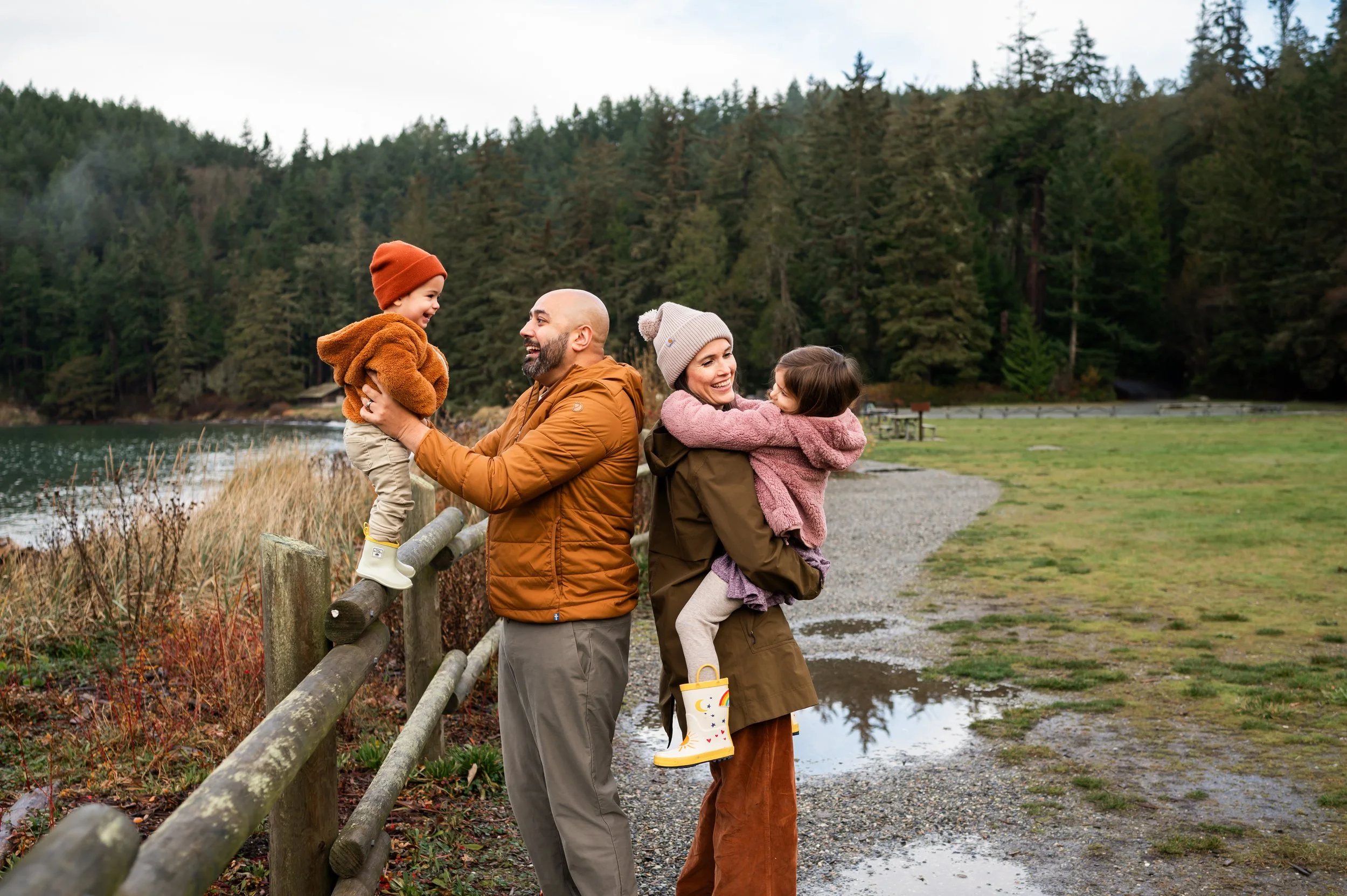 a happy family in Pacificnorthwest enjoying family photo session wearing earth bold colors