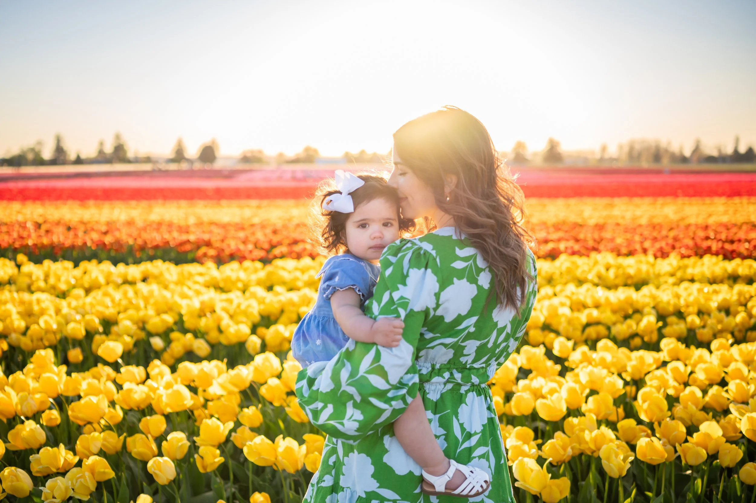 motherhood session at yellow and pink tulips at Mt Vernon, Washington