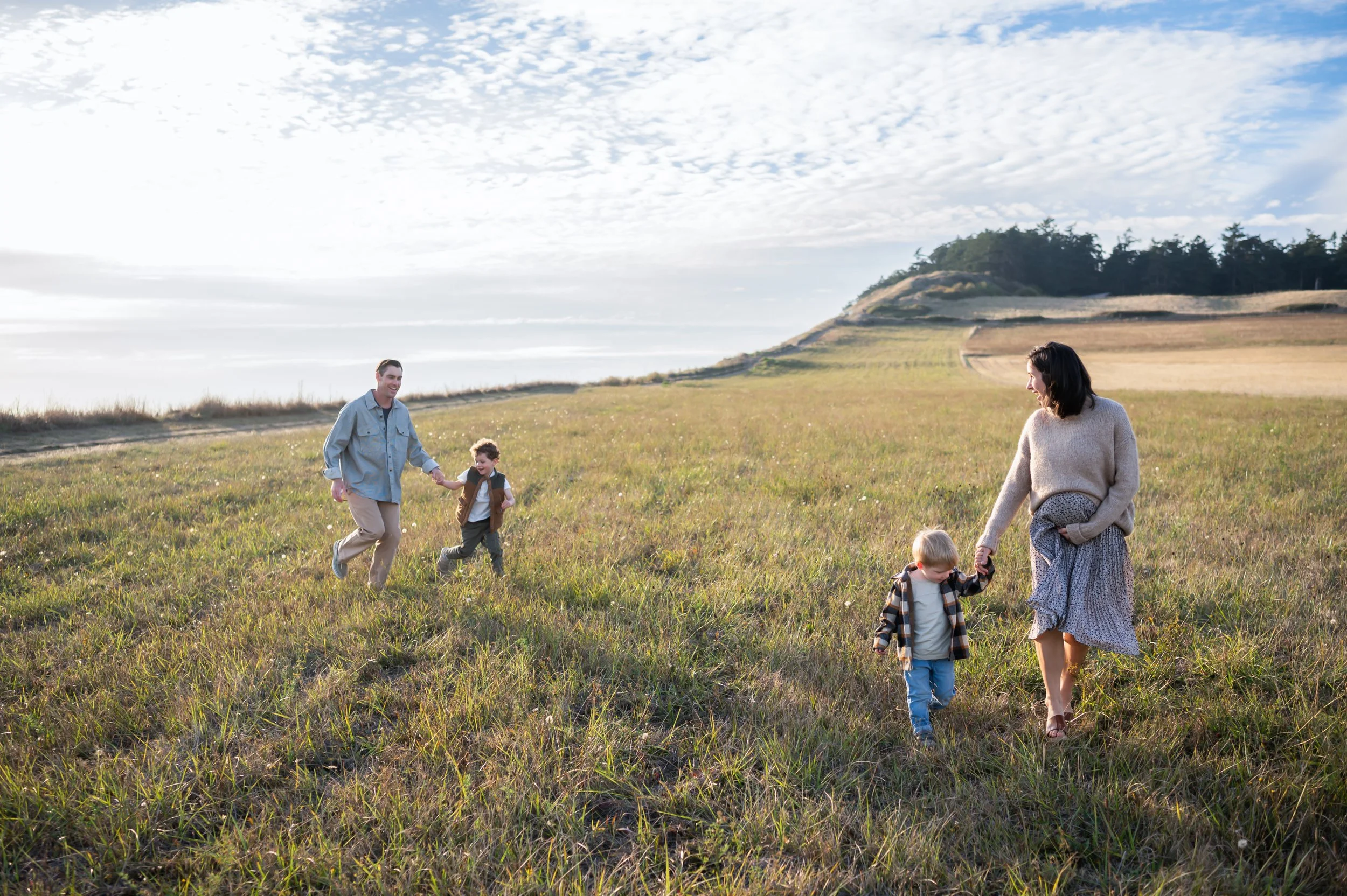 family of 5 having fall photos taken at PNW fields