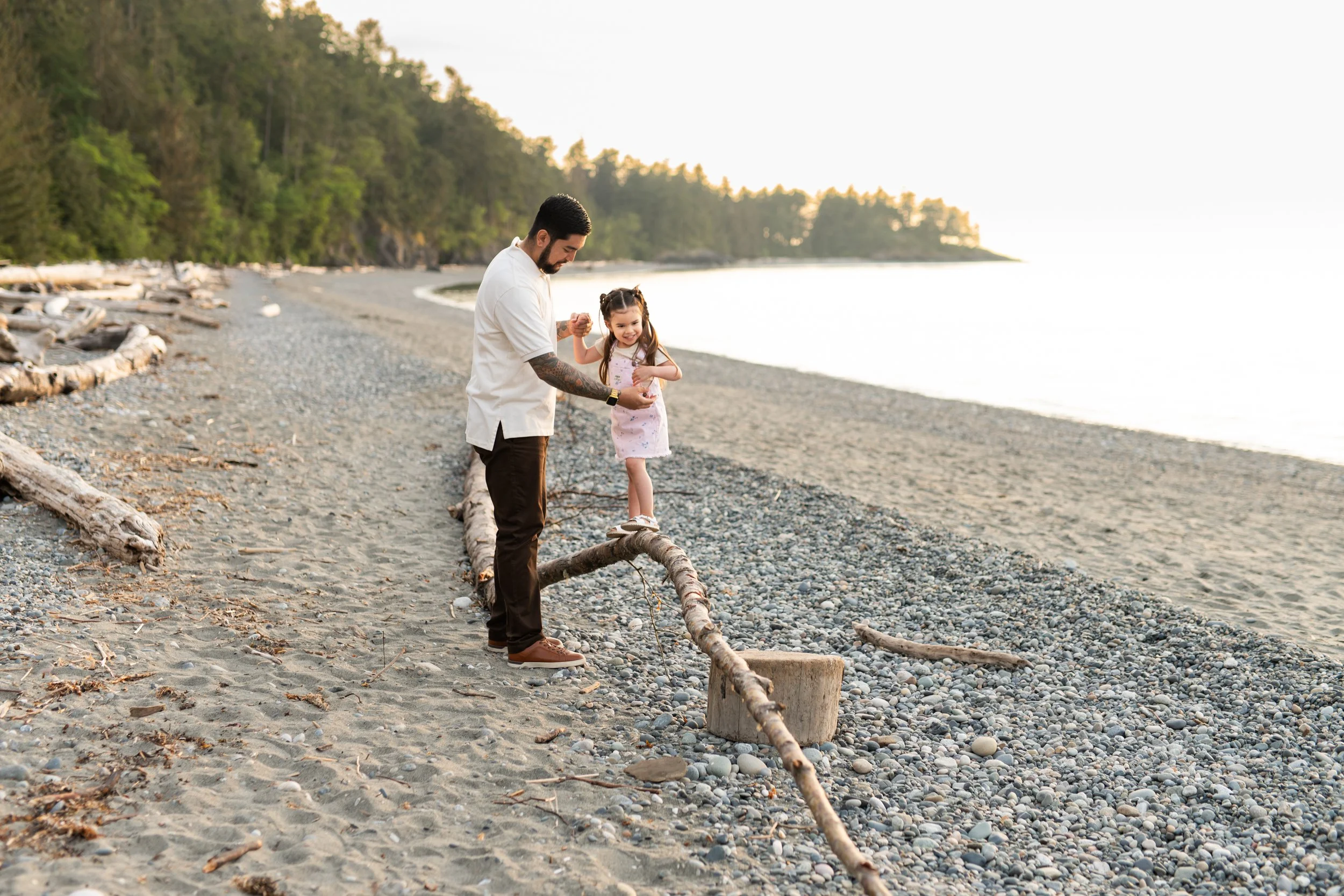 dad and daughter on the beach at sunset