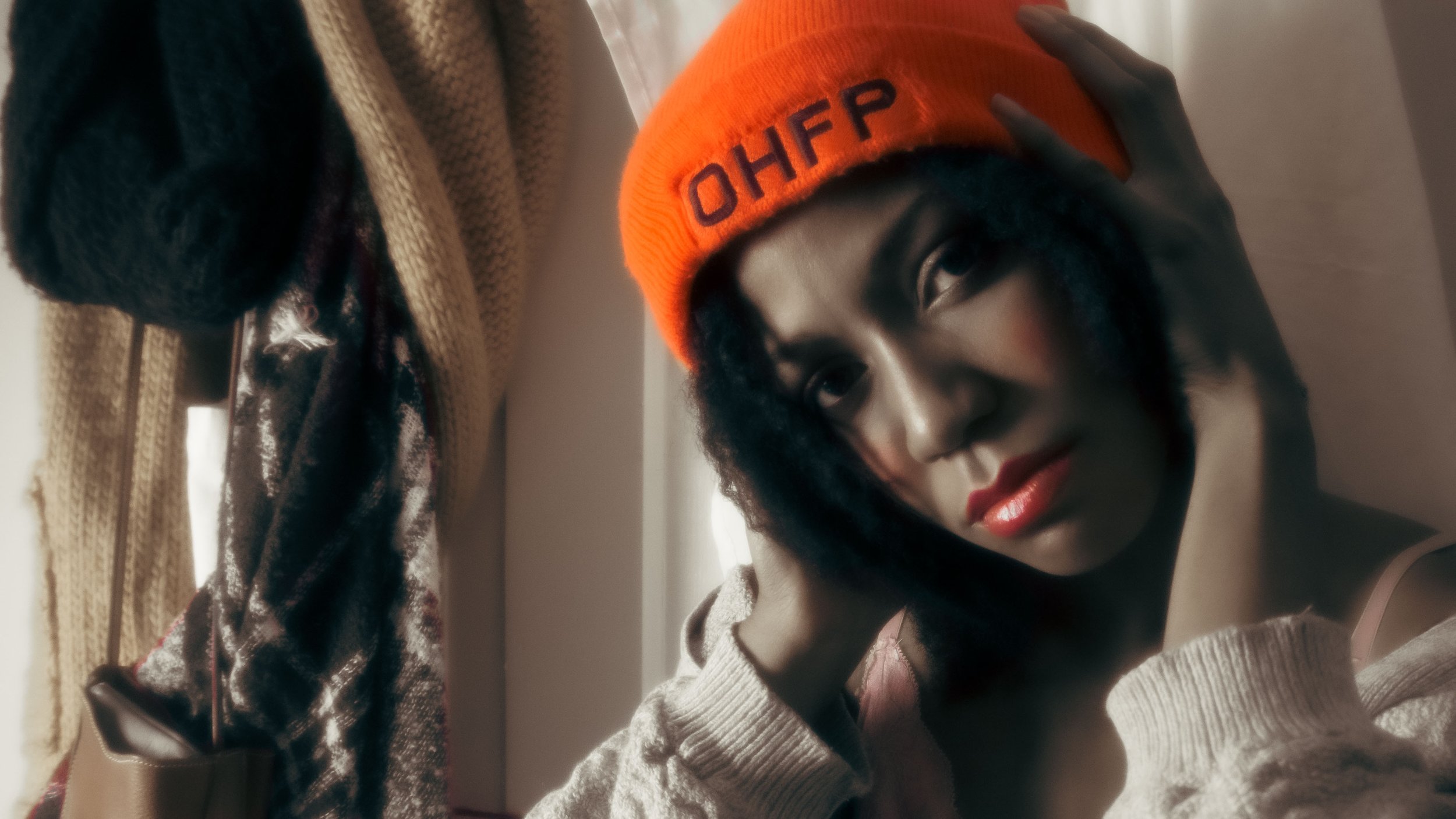 Edit-Tbraid-out-orange-hat-desat.jpg