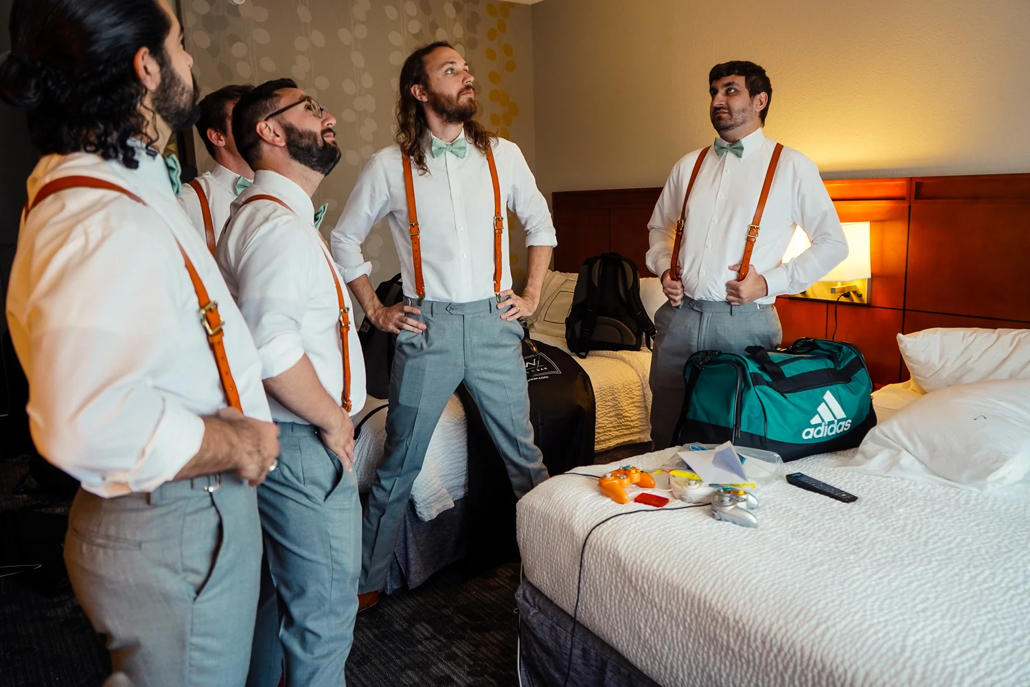 Groomsmen pose like the Avengers during wedding preparations for intimate wedding at Kylan Barn