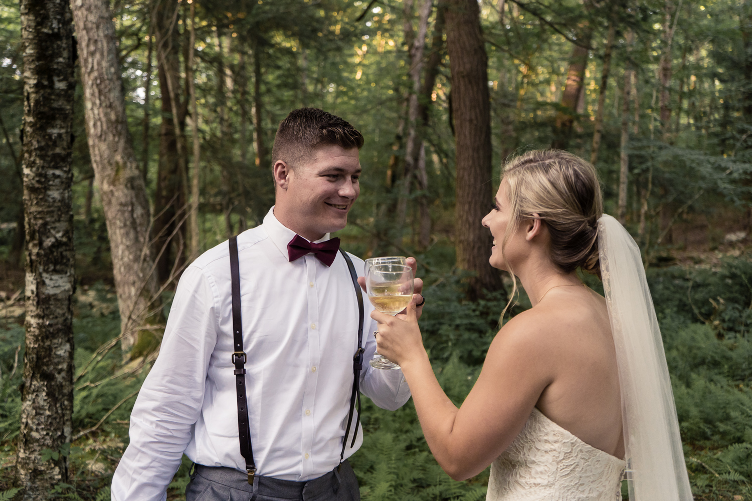 Bride and groom cheers after a perfect day eloping in the Pocono Mountains