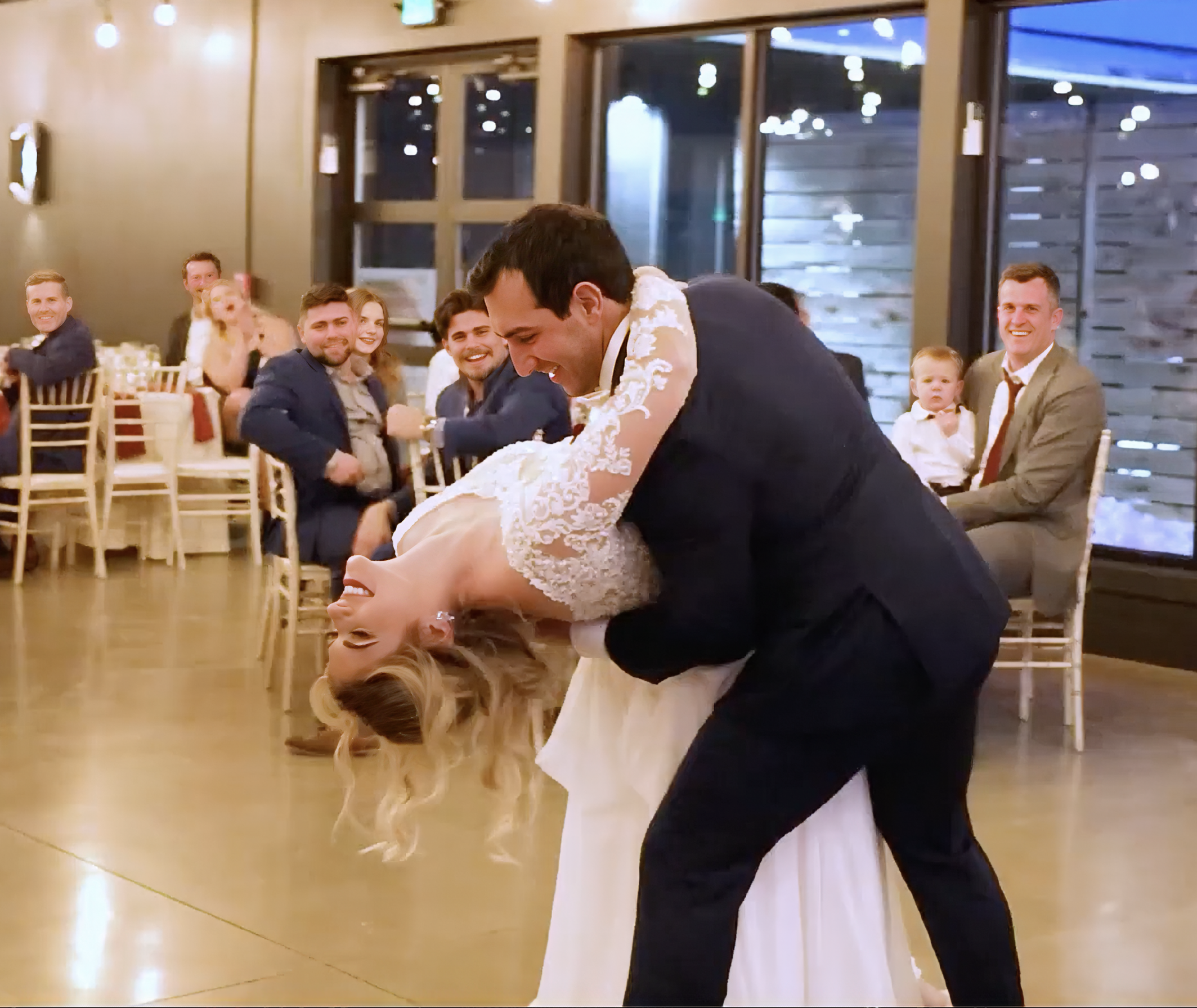A wedding couple doing a dip for their wedding reception after taking wedding first dance lessons at Dance Factory serving Arlington, Alexandria and Washington DC.