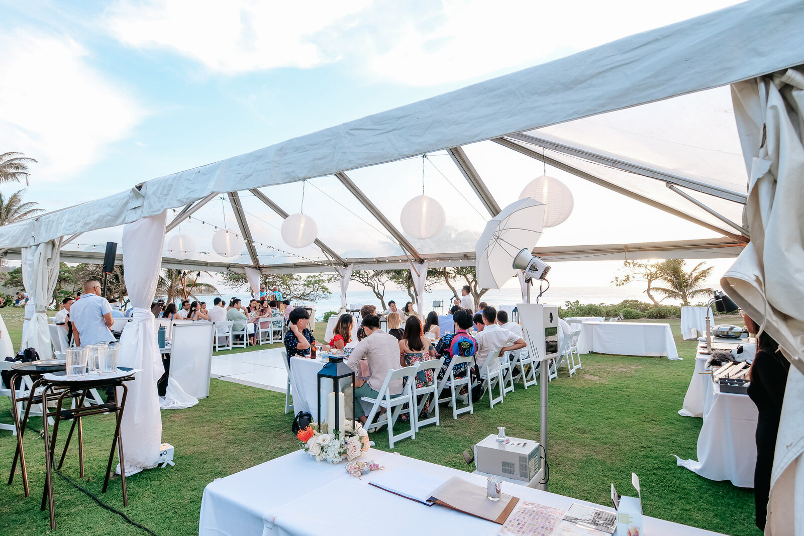Guests at wedding reception by the ocean at Turtle Bay Resort Hawaii Wedding Venue at the North Shore