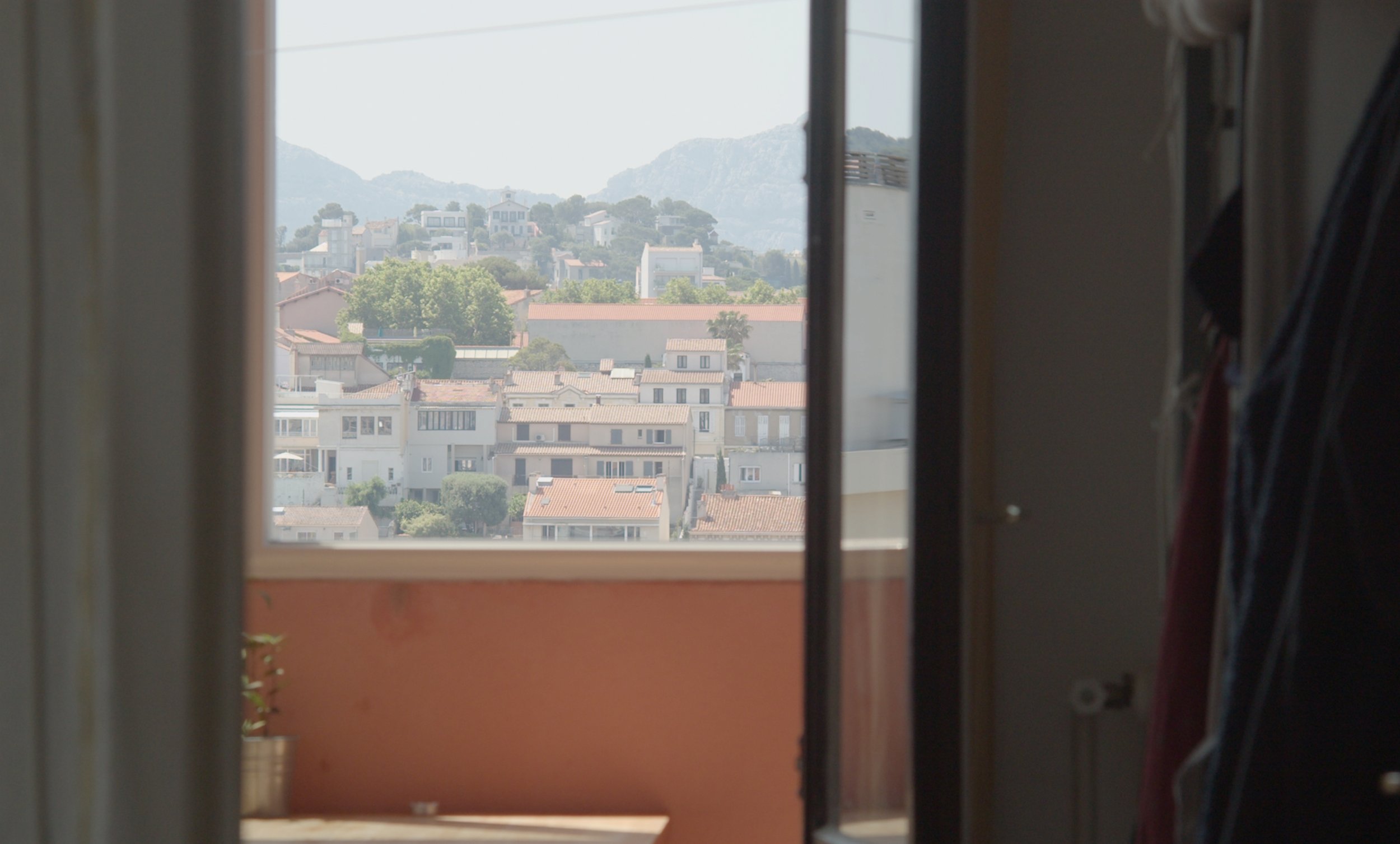   Sudden Rain  Marseille, nowadays. In an apartment perched on the 19th floor overlooking the city, two Chinese women reflect on their trajectories.  Co-directed with Yu Wang In post production  Belgium/France/China, 2024, 30 min  