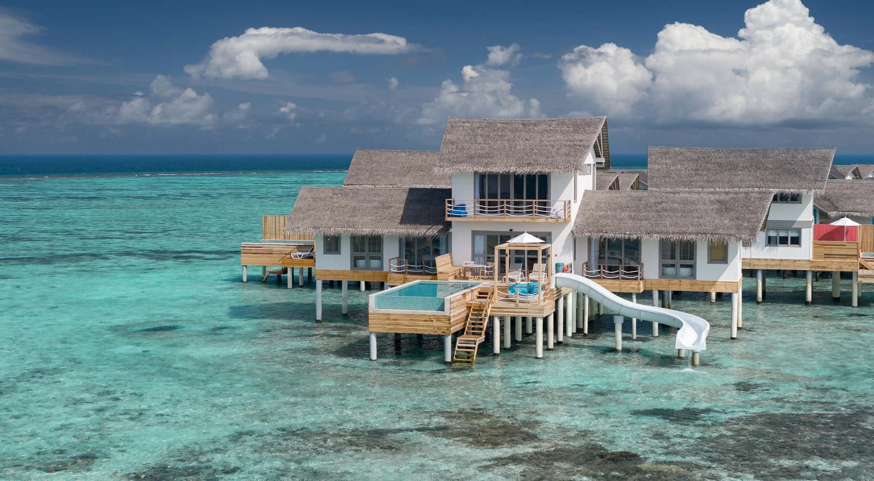 CCM - Two Bedroom Lagoon Pool Villa with Slide - Drone Shot.jpg