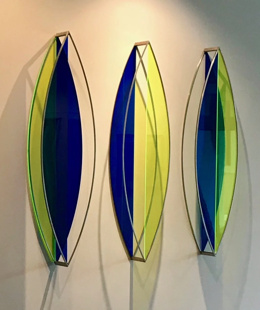 SENTINELS. STAINLESS STEEL AND PLEXIGLASS. EACH PIECE IS 4’ X 13” X 5.25”.