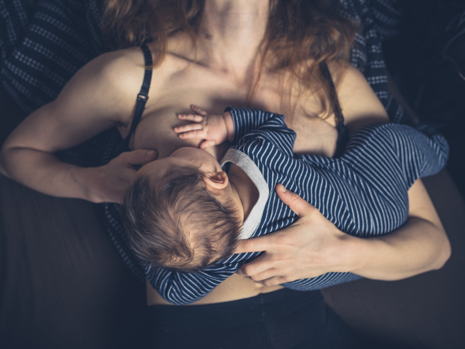 Canva - Little Baby Breastfeeding in Bed (2).jpg