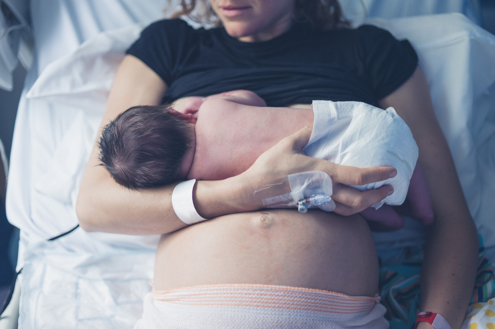Canva - Mother Breastfeeding Newborn in Hospital (1).jpg
