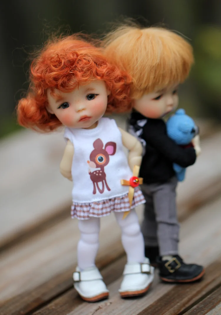 Two small Meadowdolls back to back