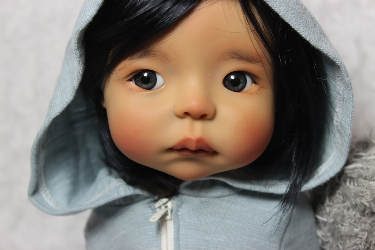 A Meadowdoll in a hooded jacket