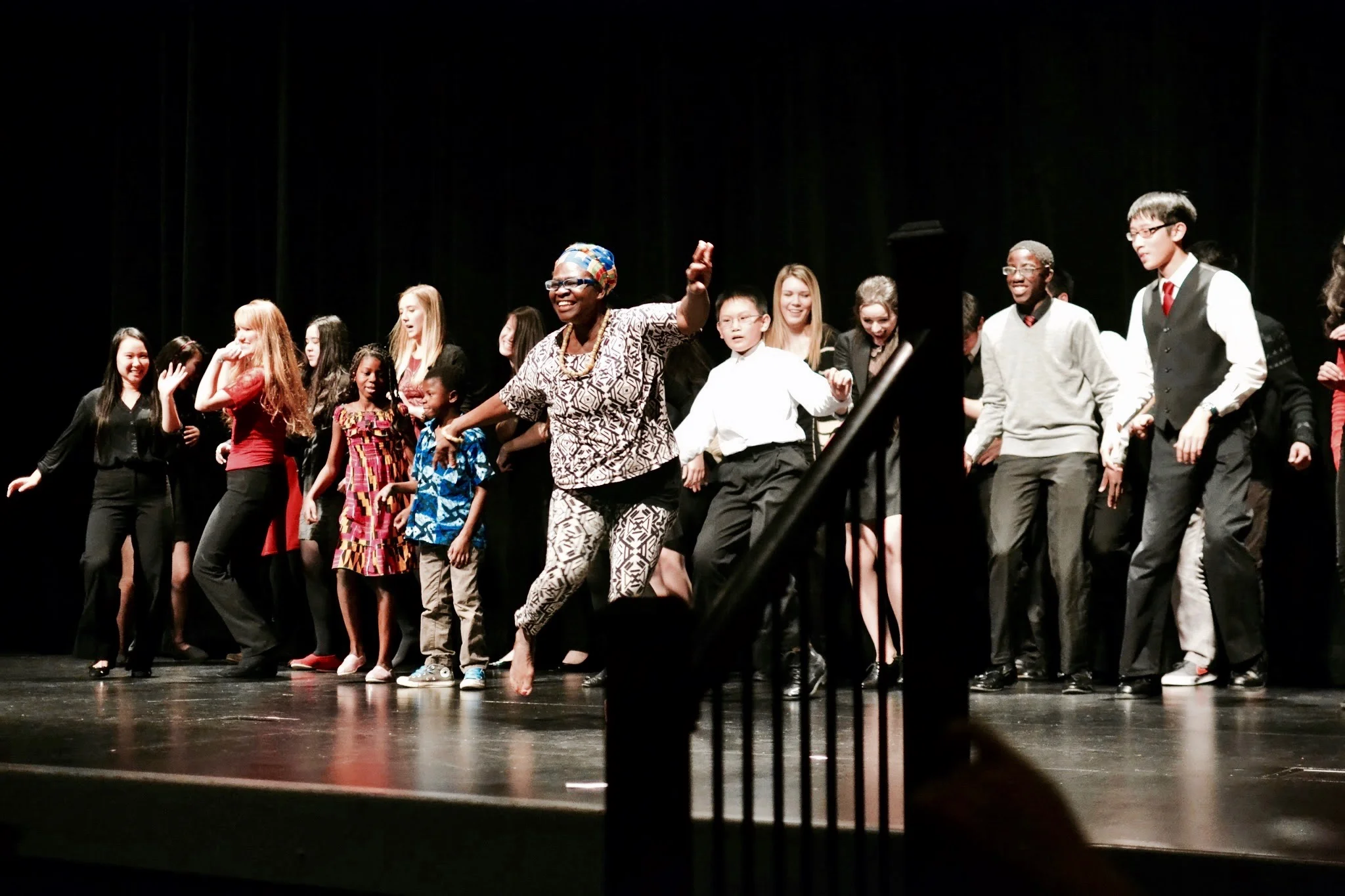 Student volunteers dancing on stage at the annual 'Ghanaian Culture Night' in Mukilteo, WA.