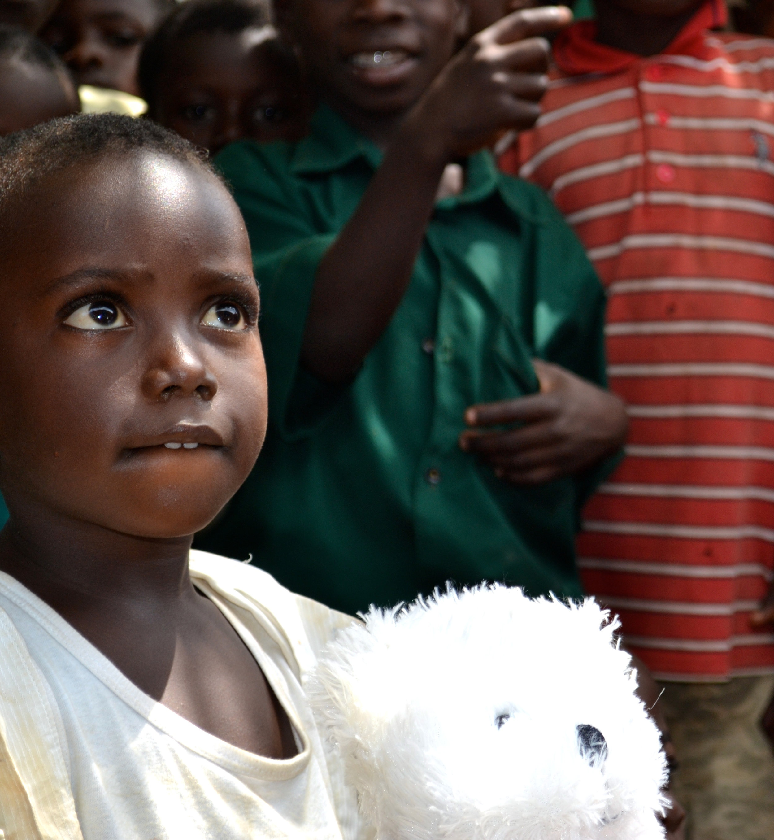  A student from Hobor orphanage with a new teddy bear 