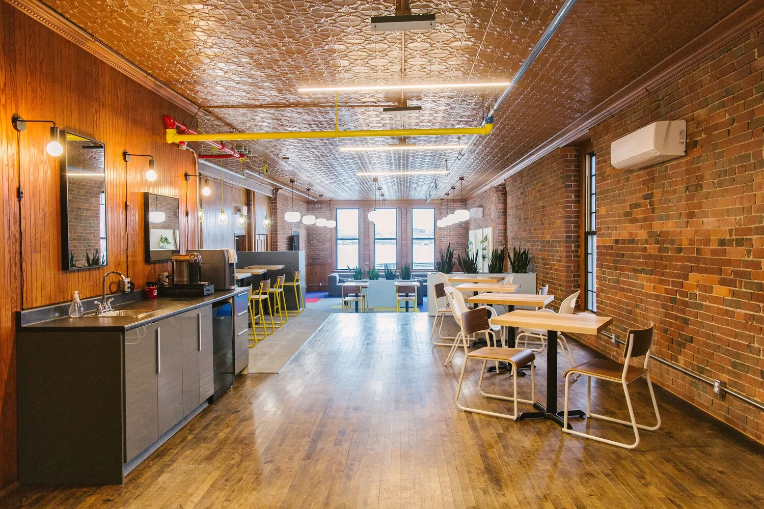 The Concourse at USTATION Harbourfront: brick walls, tin ceiling and coffee bar