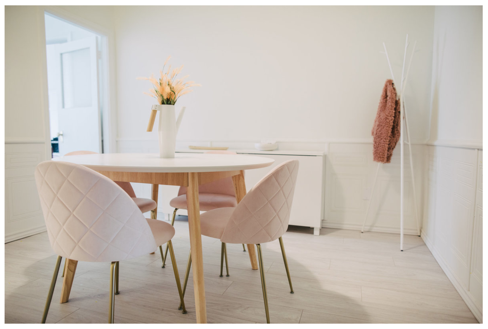 The Studio Office: round table with four chairs in a bright white room