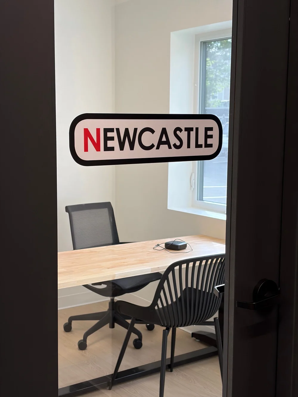 Looking into the NewCastle room through its open door