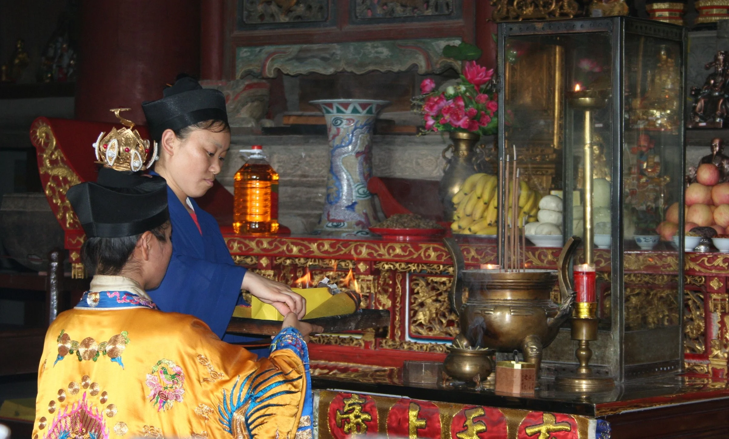 Daoist priestess burning talismans, Wudang Mountains, June 2009