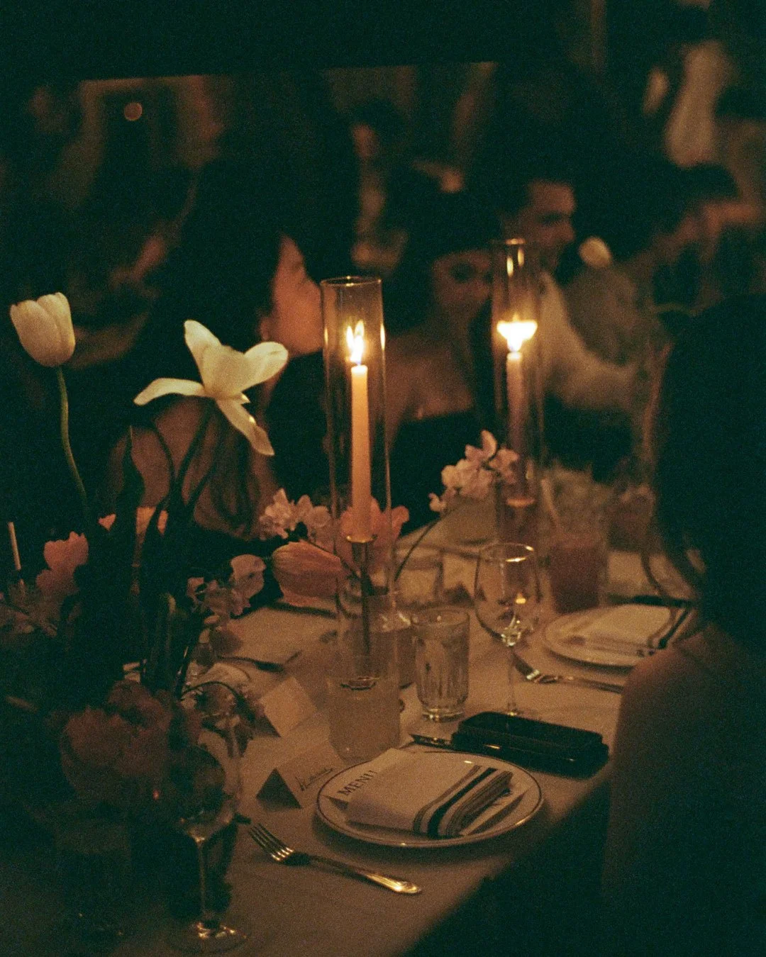 one of my most frequently asked questions is what to do if your wedding venue is super dark - and how can I capture that? I personally looove leaning into soft candle light, and the key for me is to come prepared. I always have cameras capable of cap