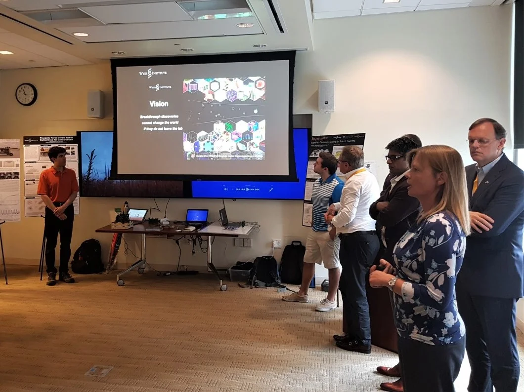 Harvard Wyss Institute: Helping Breakthrough Discoveries leave the Lab. Philips CEO Hans de Jong listens to Angelika Fretzen, who gave a nice introduction to the research projects. In the back: Justin Werfel PhD.