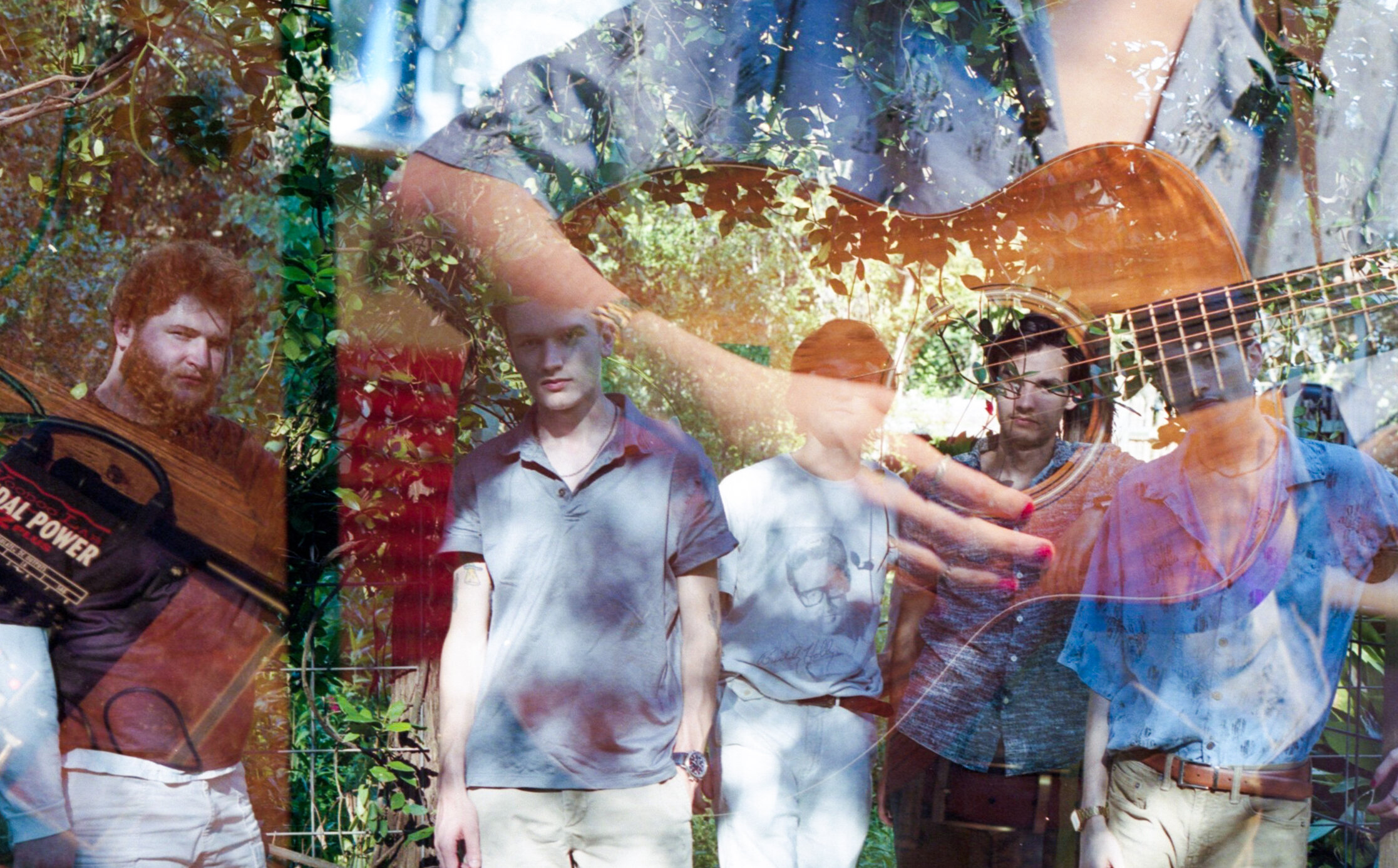  The band double exposed with Liam playing guitar. 