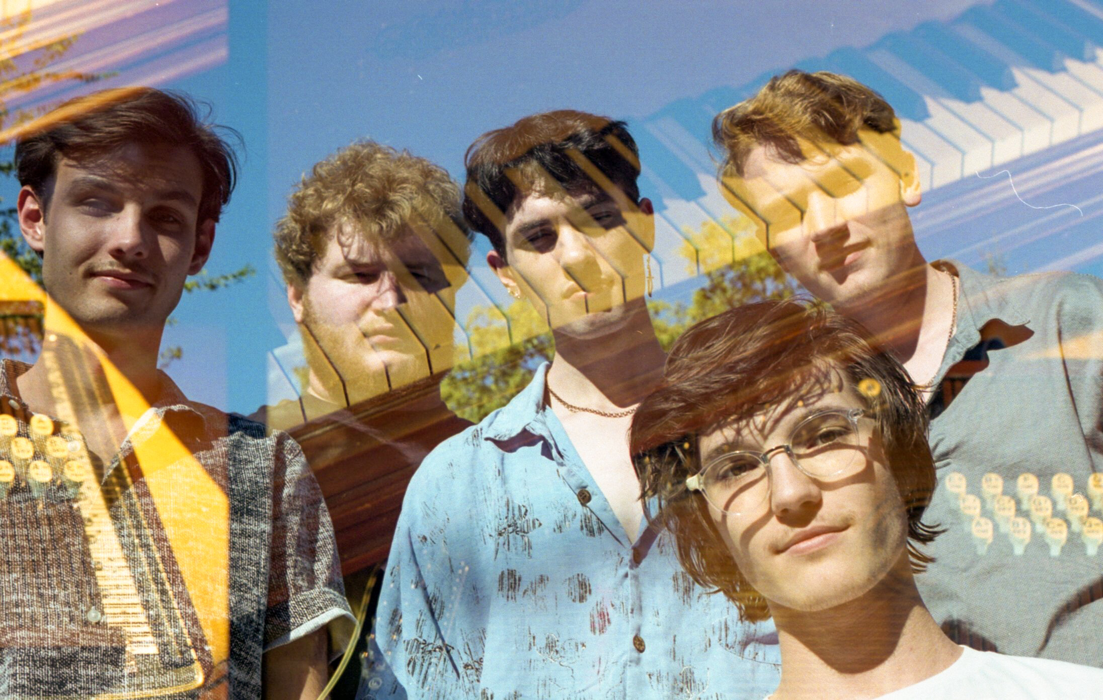  The band double exposed with their piano. 